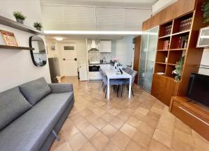 a living room with a couch and a table at ETERNA Trastevere Apartment in Rome +24 photos
