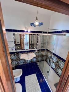 a bathroom with a shower and a sink at Suite Capri in Ischia +35 photos