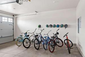 a group of bikes lined up against a wall at Cielo Blu Santa Clara #17 townhouse in Santa Clara