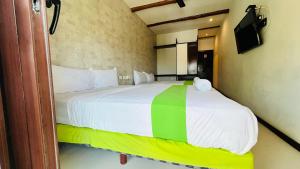Postel nebo postele na pokoji v ubytování Hotel MAYARI Holbox