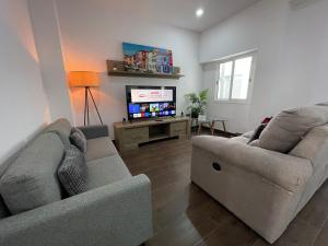 Televízia a/alebo spoločenská miestnosť v ubytovaní DREAM RAMBLA