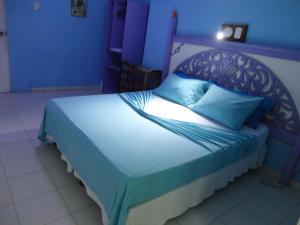Cama o camas de una habitación en Hotel Pueblito Playa