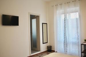 TV a/nebo společenská místnost v ubytování B&B DEGLI ANGELI