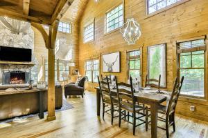 a dining room with a table and a fireplace at Ivylog Creek Getaway in Young Harris