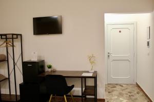 TV a/nebo společenská místnost v ubytování B&B DEGLI ANGELI