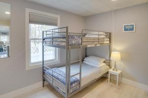 a bedroom with two bunk beds and a window at Spacious South Haven Retreat Near Lake Michigan in South Haven