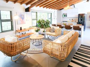 a living room with a couch and chairs and a table at Vintage House With Jacuzzi In Manila in Medellín
