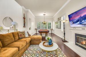 a living room with a couch and a fireplace at A Stunning Beach villa Walking to Huntington Beach in Huntington Beach