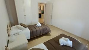 Postel nebo postele na pokoji v ubytování La Terrazza Di Athena sweet rooms