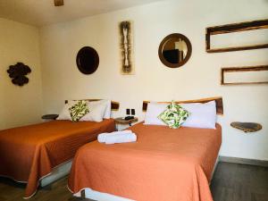 Postel nebo postele na pokoji v ubytování Hotel Diosa del Agua Bacalar