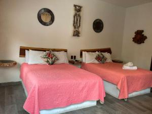 Postel nebo postele na pokoji v ubytování Hotel Diosa del Agua Bacalar