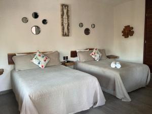 Postel nebo postele na pokoji v ubytování Hotel Diosa del Agua Bacalar