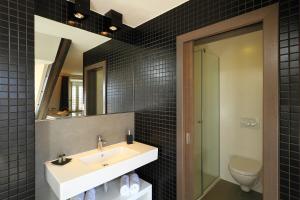 Kúpeľňa v ubytovaní La Porta Luxury Rooms + 17 fotografií