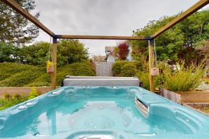 a hot tub in a backyard with a gazebo at Good Fortune in McKinleyville