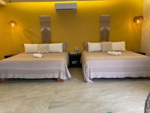 Postel nebo postele na pokoji v ubytování Hotel Diosa del Agua Bacalar