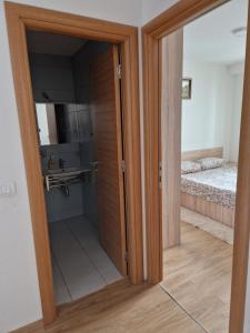 a sliding door in a room with a bedroom at Gondola Mako Exclusive in Zlatibor +46 photos