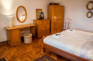 Postel nebo postele na pokoji v ubytování Petrov konak - apartman Petar