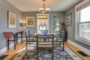 a dining room with a table and chairs and a stained glass window at 2 Mi to Washington Park Convenient Denver Home! in Denver