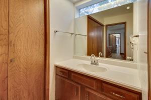a bathroom with a sink and a mirror at Gassville Home 3 Mi to White River and Trout Fishing in Gassville +30 photos
