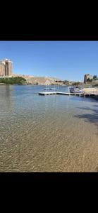 a large body of water with a pier and buildings at River view Lazy Casa in Bullhead City