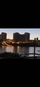 a view of a river with buildings in the background at River view Lazy Casa in Bullhead City