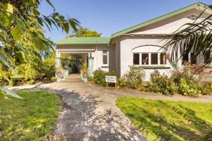 a house with a driveway leading to it at History @ Renall in Masterton