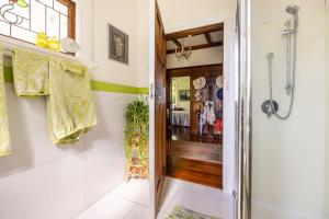 a bathroom with a shower and a walk in closet at History @ Renall in Masterton