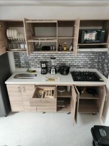 Una cocina o kitchenette en Moderno y Amplio Apartamento