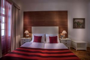 Postel nebo postele na pokoji v ubytování Little King Hotel U Malvaze