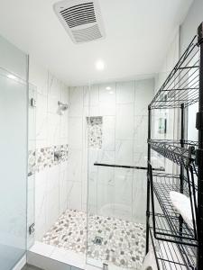 a bathroom with a shower with a glass door at Spacious 4BR 4BA in Hollywood - Ful-WH in Los Angeles