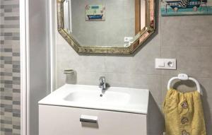 a bathroom with a sink and a mirror at Awesome Home In Ortigueira With Wifi in Ladrido
