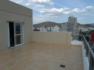 a balcony with a view of a city at Casa Magno Apart Boutique in Salta