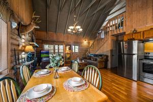 a dining room with a wooden table and chairs at Ridgecrest in Gatlinburg