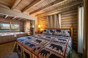 a bedroom with a bed in a log cabin at Ridgecrest in Gatlinburg
