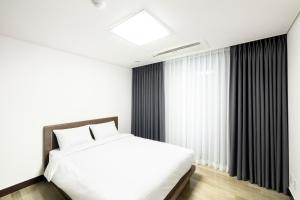 Postel nebo postele na pokoji v ubytování Pale De Cz Condo