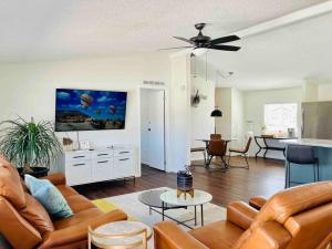 a living room with a couch and a ceiling fan at Death Valley Hot Springs 2 Bedroom in Tecopa