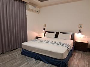 Postel nebo postele na pokoji v ubytování 澎湖民宿 7 Hostel
