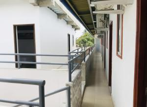 an empty hallway of a school building with metal railing at Hostería Altamar Tolú in Tolú