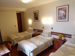 Postel nebo postele na pokoji v ubytování Antawasi Hotel