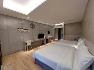Una cama o camas en una habitación de 麗詩旅海景民宿