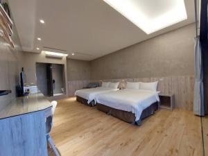 Una cama o camas en una habitación de 麗詩旅海景民宿