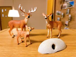 a group of fake deer on a table at LuLu Stay in Wakkanai