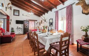 a large dining room with a table and chairs at Pet Friendly Home In Peaflor With Wifi in Peñaflor