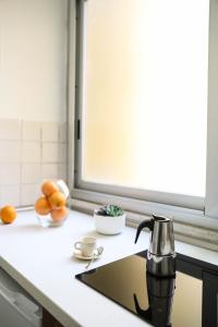 Kuchyň nebo kuchyňský kout v ubytování Aura Home rent of rooms with shared kitchen