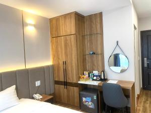 Postel nebo postele na pokoji v ubytování HO TRAM GOLDEN HOTEL