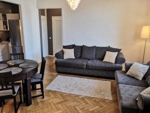 a living room with a couch and a table at Gonsiori 3 Tenors Apartment in Tallinn
