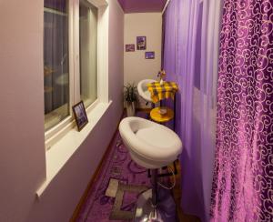 a small bathroom with a sink and a window at Luxury apartment Sicheslavska street in Kryvyi Rih