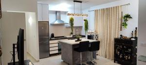 a kitchen with a island in the middle of a kitchen at Calpe 100 m de playa in Calpe