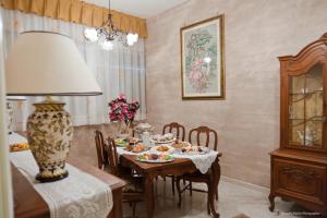 a dining room with a table with food on it at La Baronessa in Tiggiano
