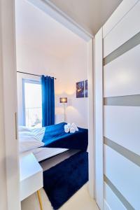 Posteľ alebo postele v izbe v ubytovaní LAGUNA Apartament Polanica Residence 59 z klimatyzacją + 29 fotografií